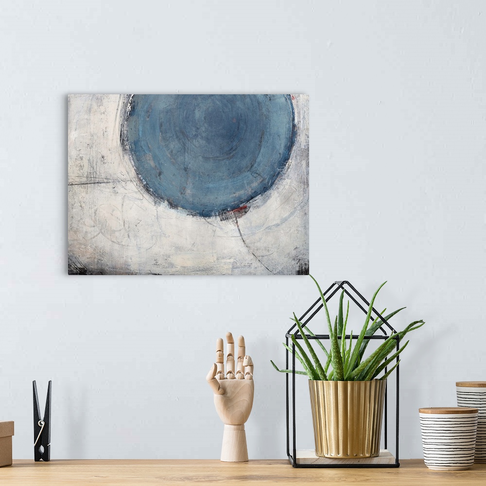 A bohemian room featuring Contemporary abstract painting of a large pale blue circle against a pale gray larger circular sh...