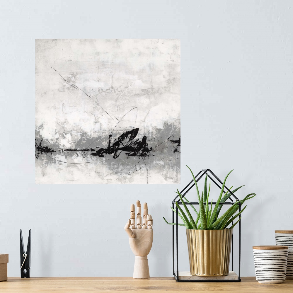 A bohemian room featuring Abstract art of thin swirling lines of black and grey paint on a roughly brushed light background.