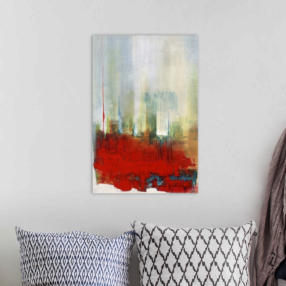 A bohemian room featuring Contemporary abstract artwork in bright red with hazy blue and green.