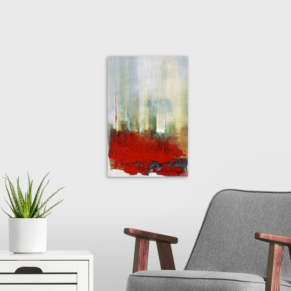 A modern room featuring Contemporary abstract artwork in bright red with hazy blue and green.