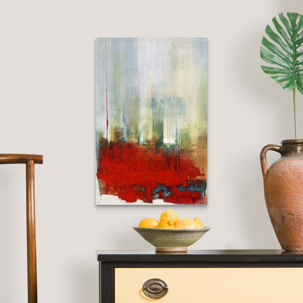 A traditional room featuring Contemporary abstract artwork in bright red with hazy blue and green.