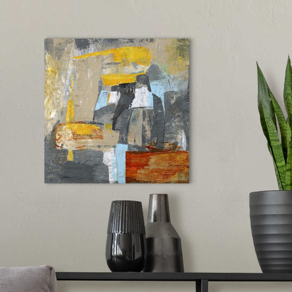 A modern room featuring Contemporary abstract artwork in grey and blue with pops of bright yellow.