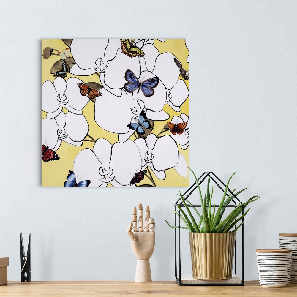 A bohemian room featuring Modern square painting of white flowers surrounded by colorful butterflies.