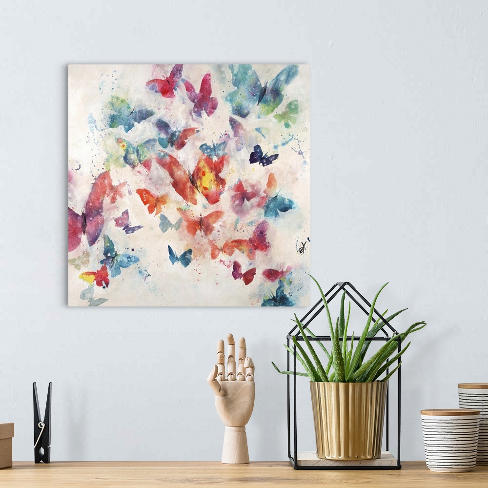 A bohemian room featuring Contemporary painting of a cluster of butterflies in various sizes and colors, on a light neutral...