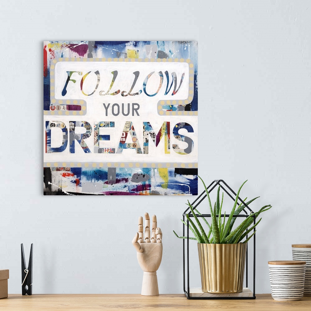 A bohemian room featuring The words "follow your dreams" made of a newsprint collage, outlined in white.
