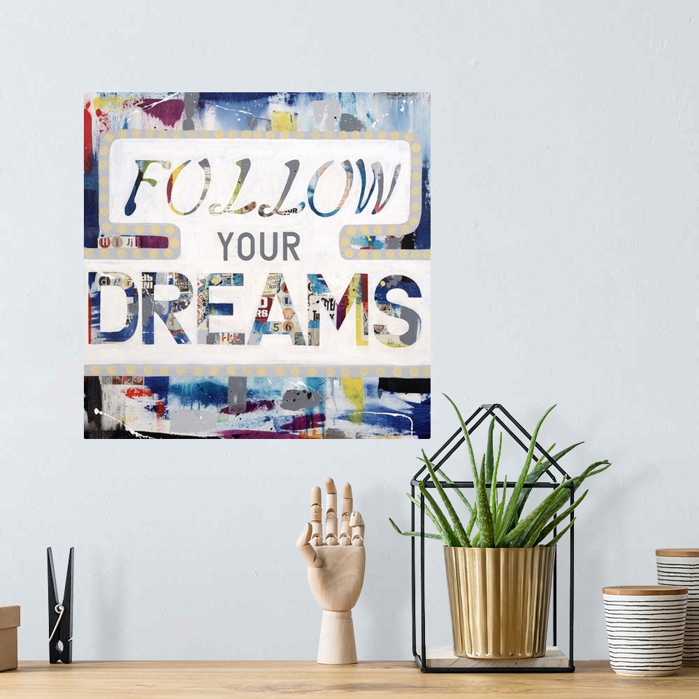 A bohemian room featuring The words "follow your dreams" made of a newsprint collage, outlined in white.