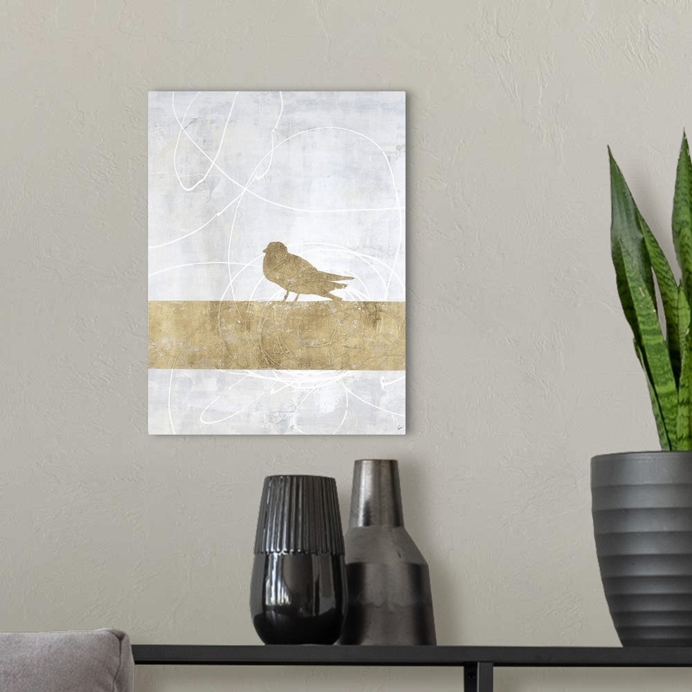 A modern room featuring A bird on a limb in gold with a gray background with white swirls.