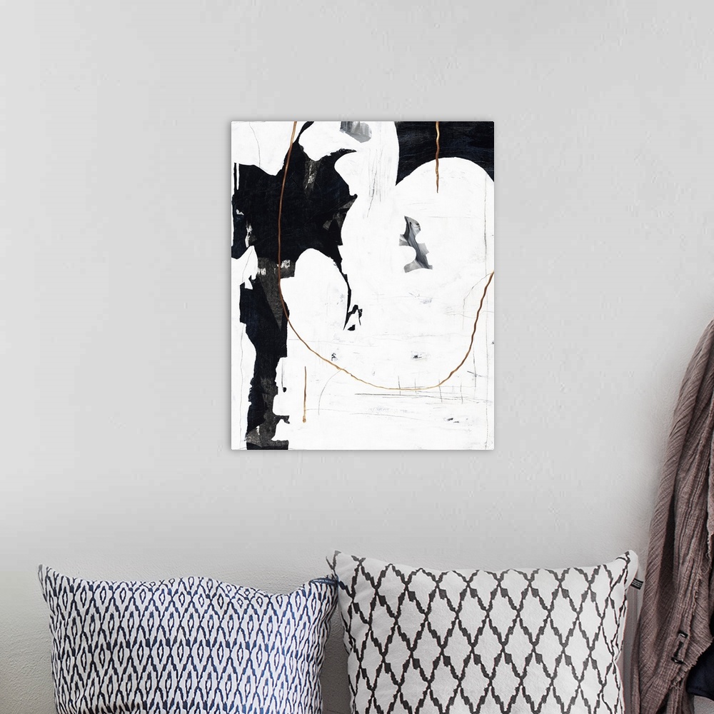 A bohemian room featuring Black and white abstract painting with metallic gold accents.