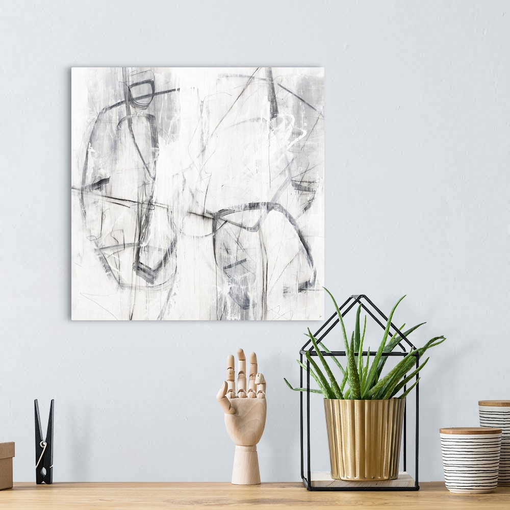 A bohemian room featuring Square painting with abstract figures created with loose lines in shades of gray and white.