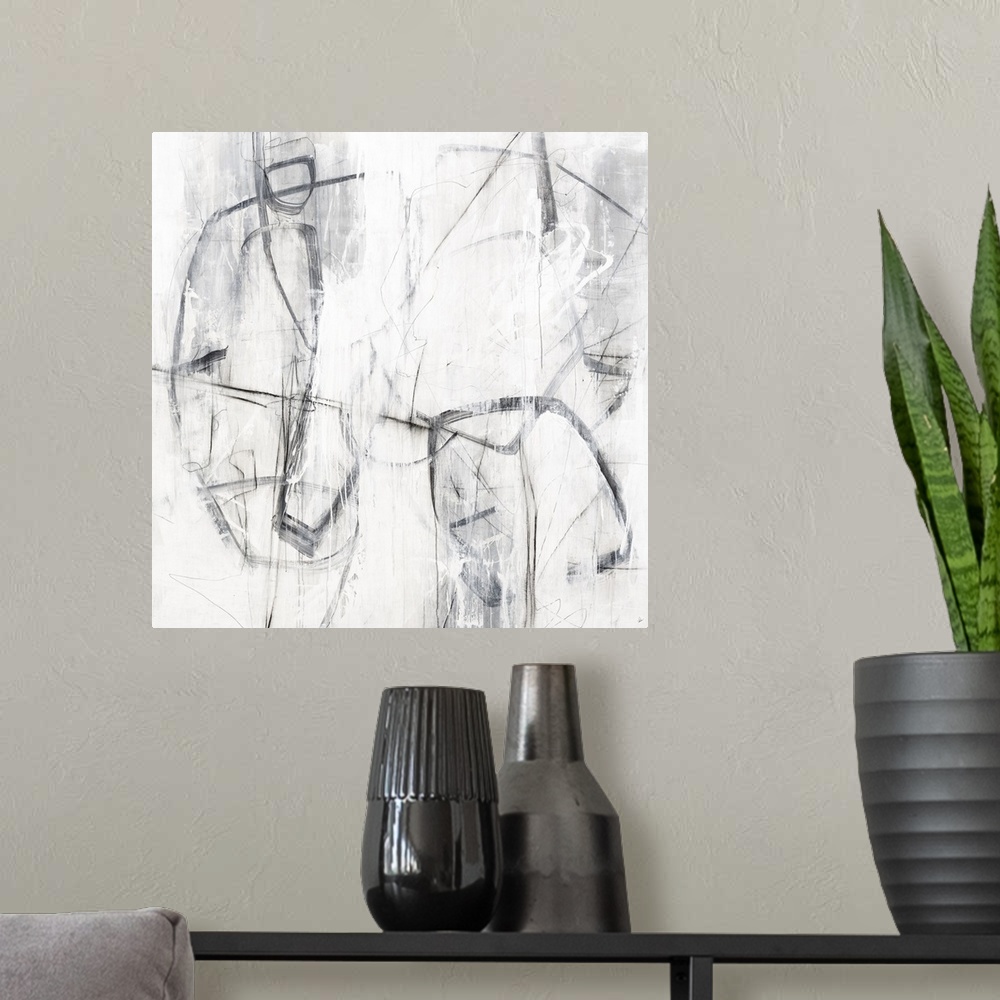 A modern room featuring Square painting with abstract figures created with loose lines in shades of gray and white.