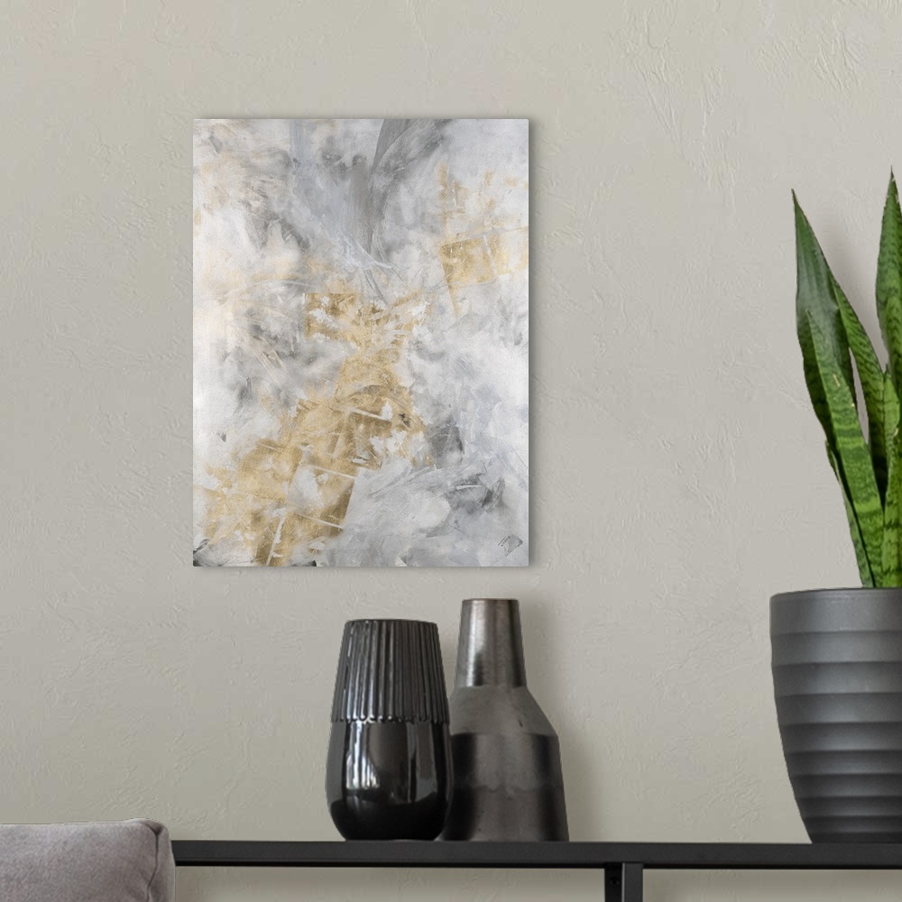 A modern room featuring Abstract painting of a textured design in shades of silver and gold.
