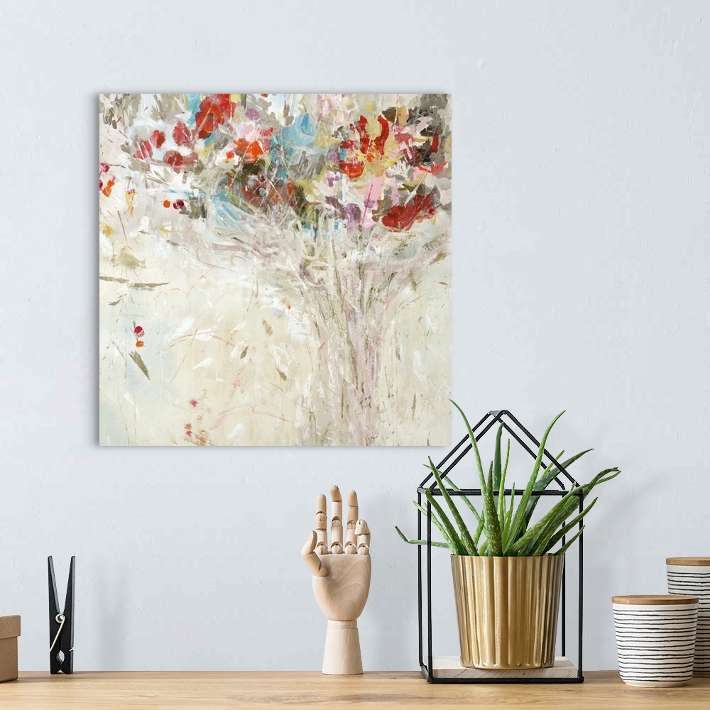 A bohemian room featuring Square painting of an abstract bouquet of colorful flowers on a neutral colored background.