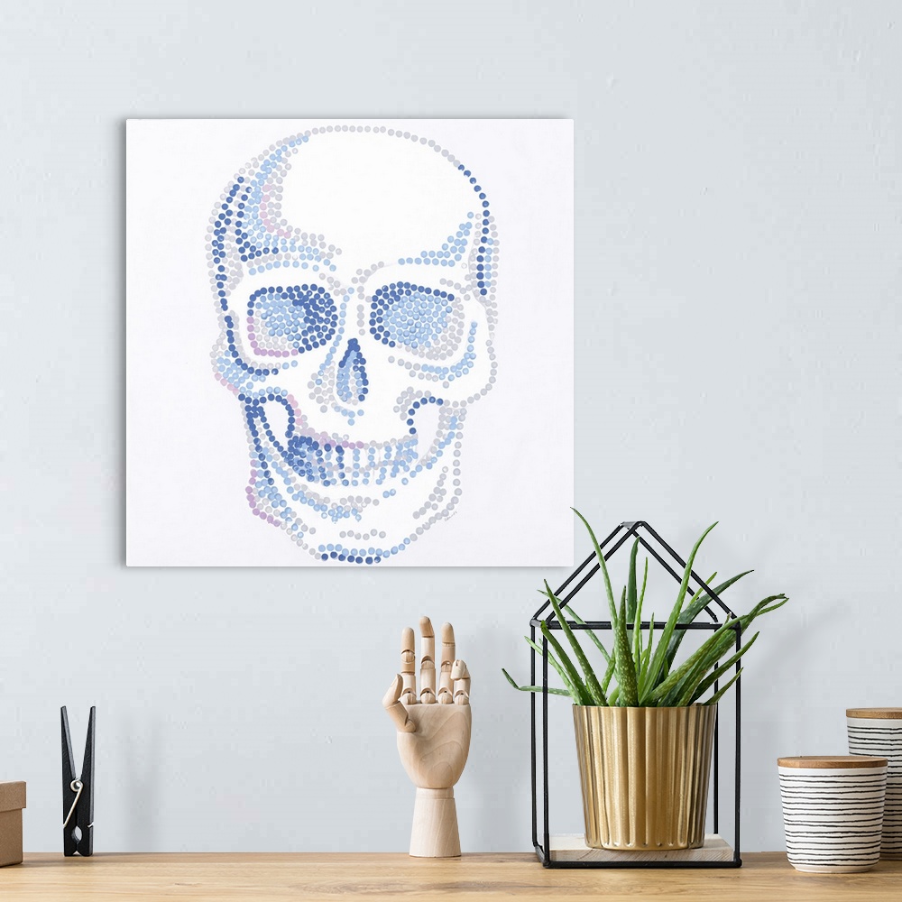 A bohemian room featuring Contemporary painting of a human skull made of small dots in blue, gray and pink.