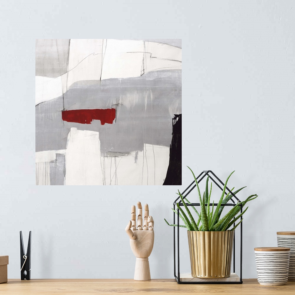 A bohemian room featuring Contemporary abstract painting using gray tones with a pop of red color.