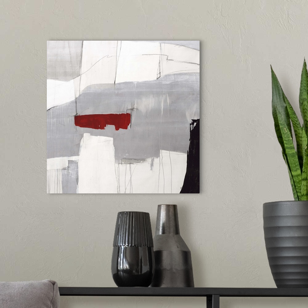 A modern room featuring Contemporary abstract painting using gray tones with a pop of red color.