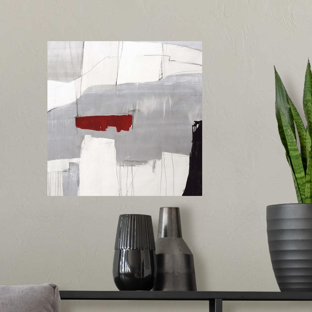 A modern room featuring Contemporary abstract painting using gray tones with a pop of red color.