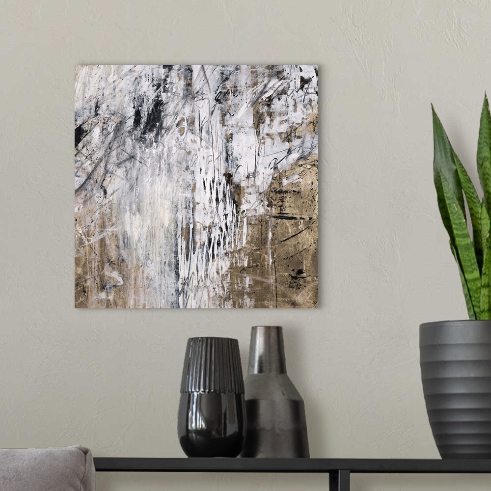 A modern room featuring Abstract painting using washed out light colors dripping over earth textured looking earth tones.