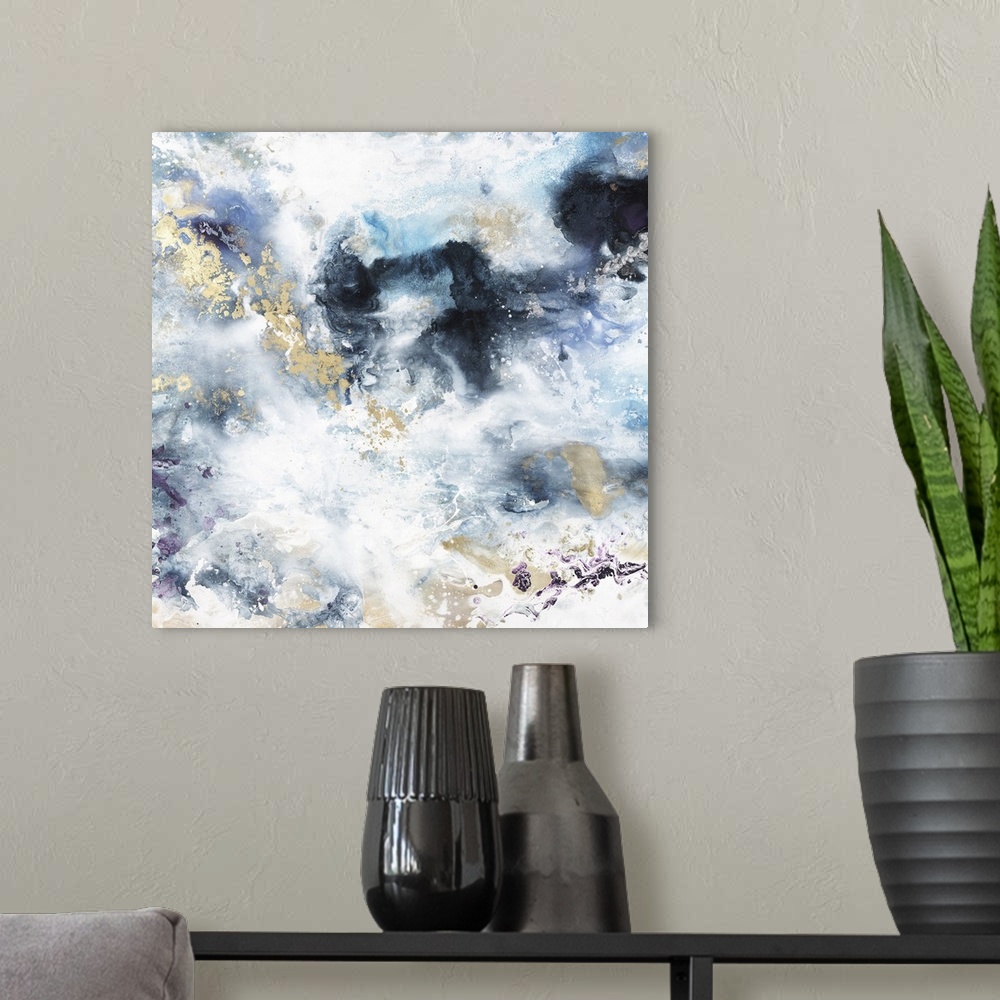 A modern room featuring Abstract contemporary painting in blue and gold tones, resembling a stormy sky.