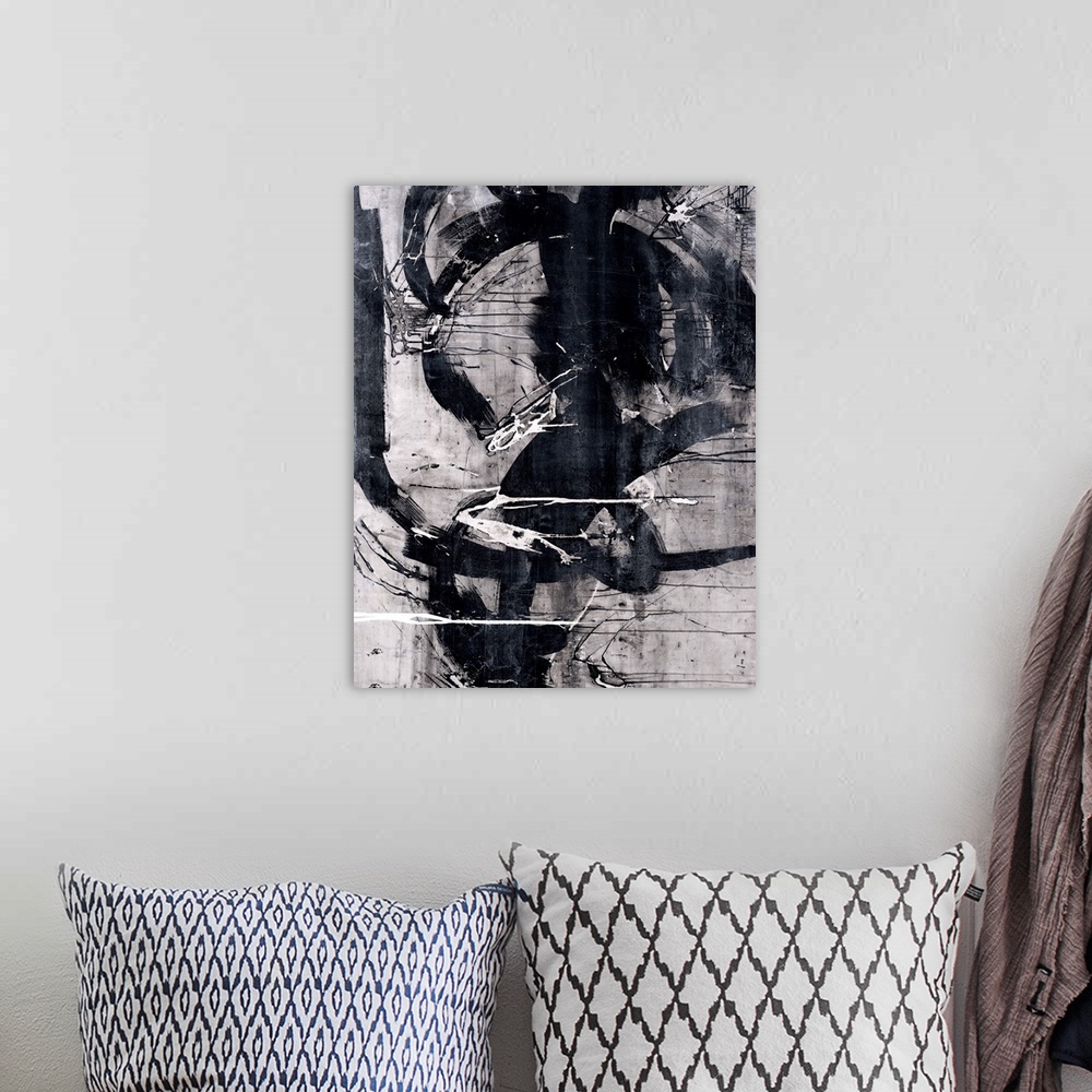 A bohemian room featuring Abstract painting that has black, white, and gray hues with thick, bold, black curvy lines domina...