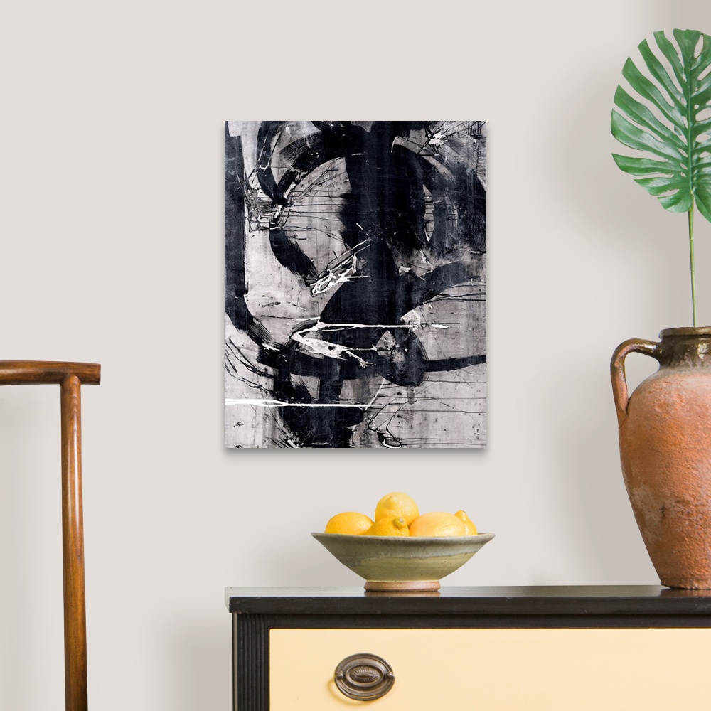 A traditional room featuring Abstract painting that has black, white, and gray hues with thick, bold, black curvy lines domina...