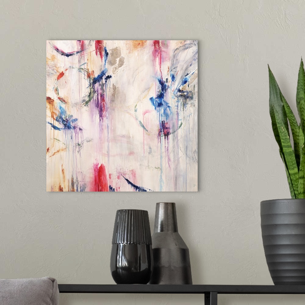 A modern room featuring Square abstract painting with bright pops of color and faint circular figures with paint dripping...