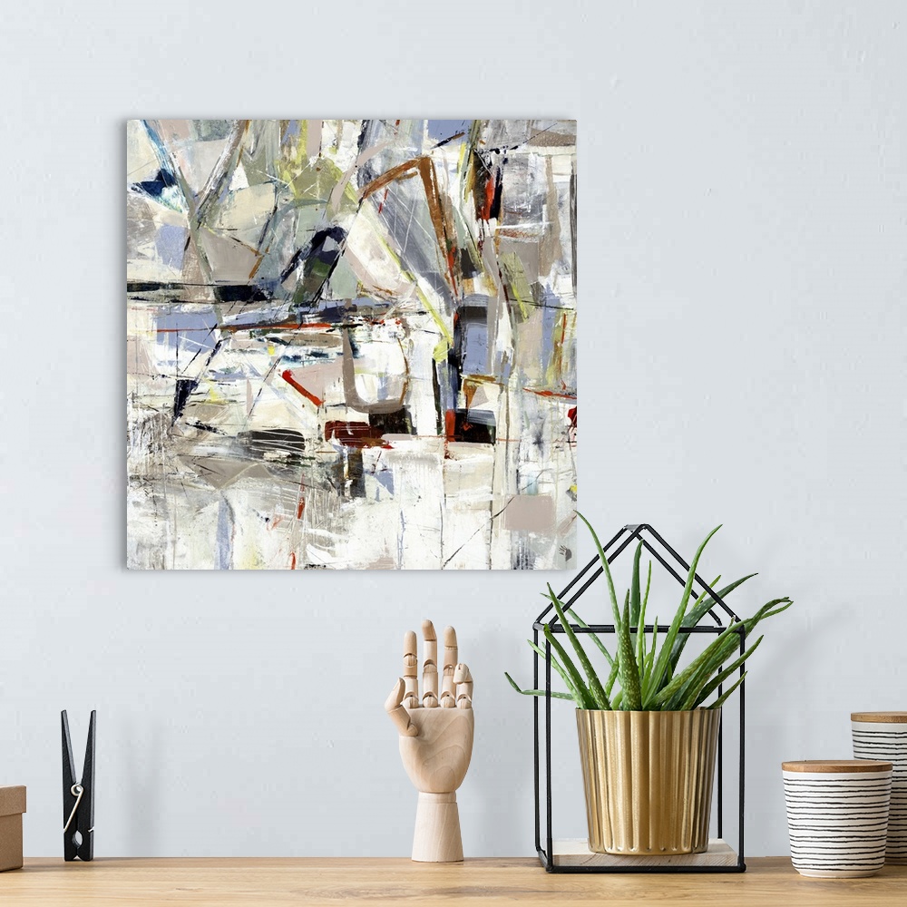 A bohemian room featuring Square abstract painting of angled lines and textured shapes in natural tones.