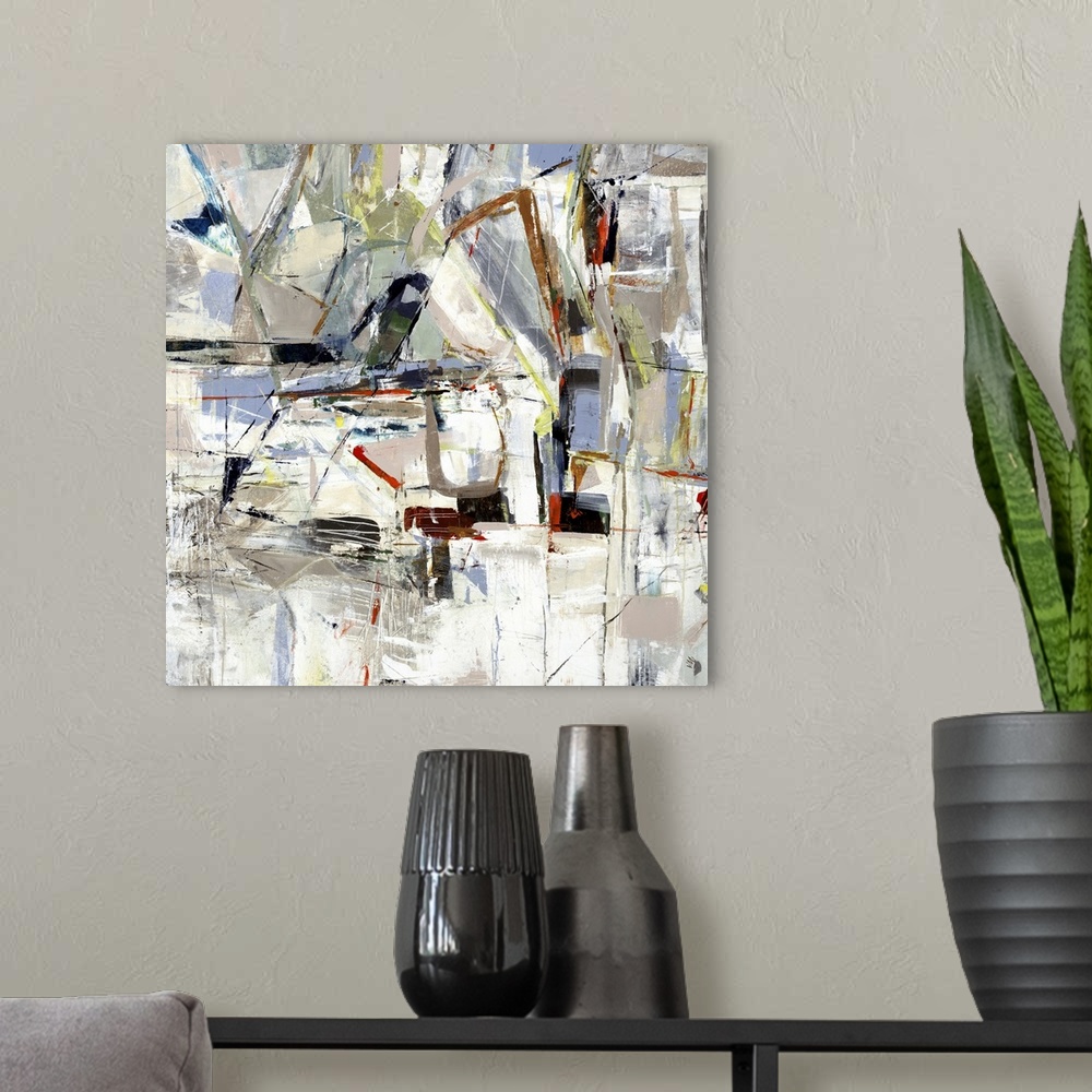 A modern room featuring Square abstract painting of angled lines and textured shapes in natural tones.
