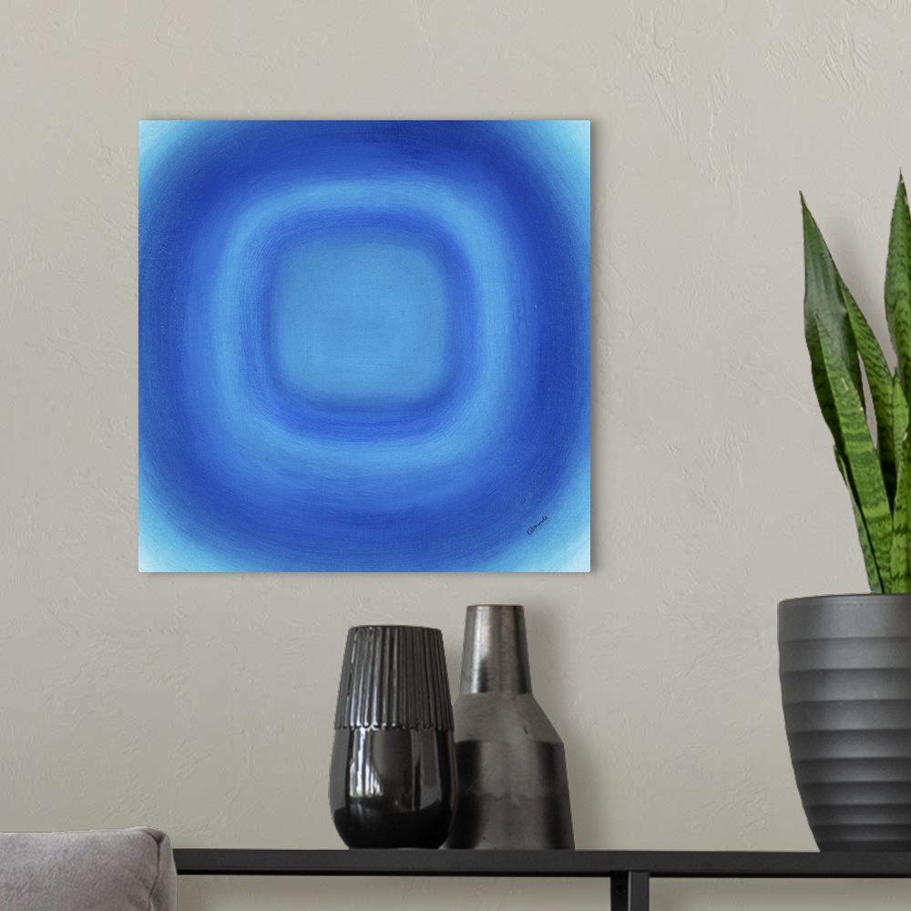 A modern room featuring A contemporary abstract painting of a blue circle with gradating green circles moving concentrica...