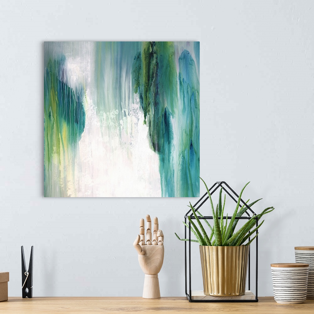 A bohemian room featuring Square abstract painting with shades of blue and green coming together and falling from top to bo...