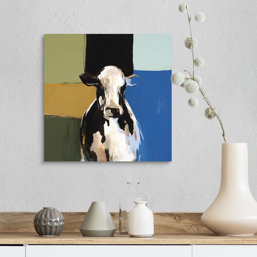 A farmhouse room featuring Contemporary painting of the bust of a black and white cow, on a multicolored background of squar...
