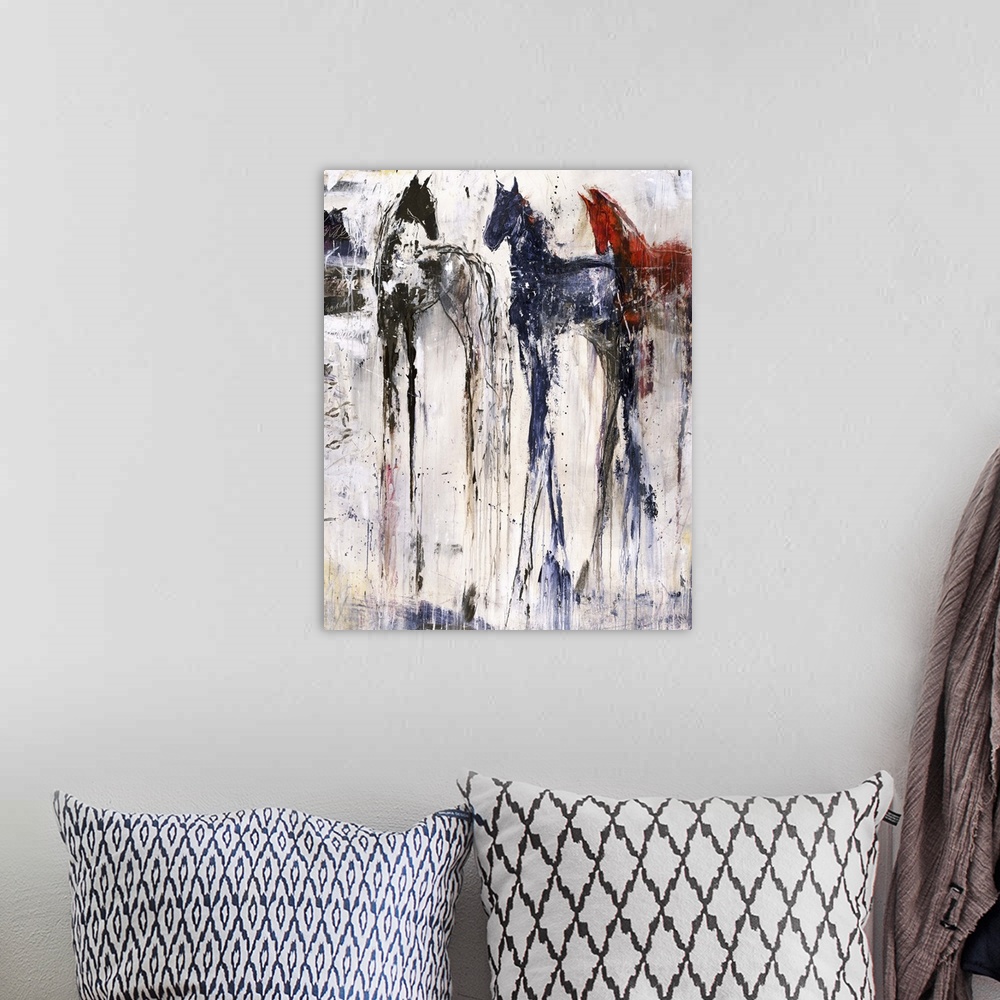 A bohemian room featuring Tall abstract painting of three horses with vertical lines of color.