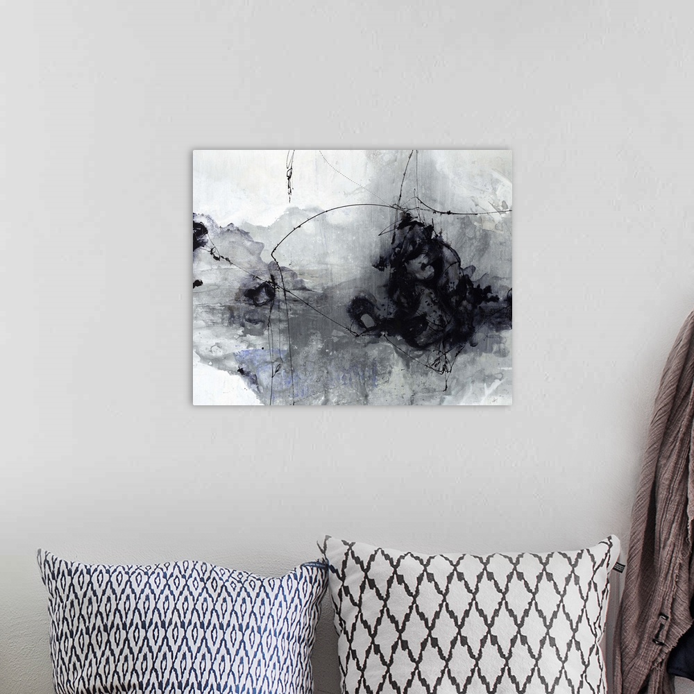A bohemian room featuring Contemporary painting of a black and gray cloud-like shape against a neutral background.