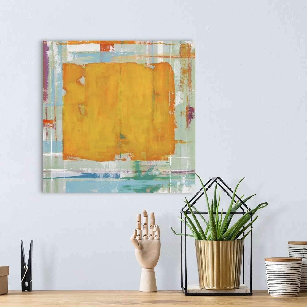 A bohemian room featuring Abstract painting with an orange rectangle in the center of the image against blue and yellow col...
