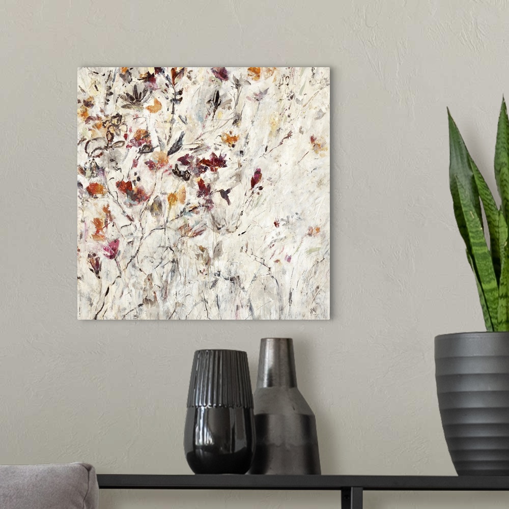 A modern room featuring Square painting with orange, pink, and red abstract flowers on a neutral colored background.