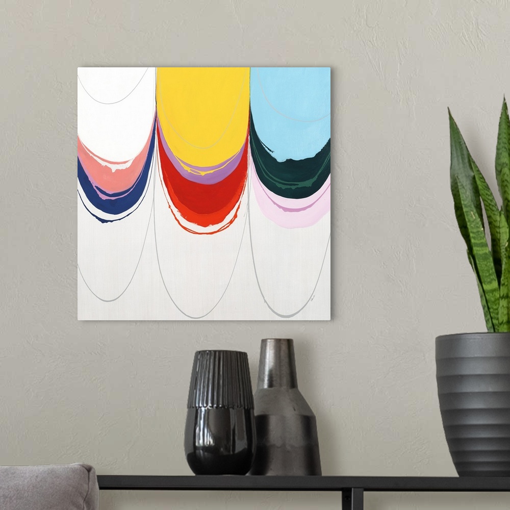 A modern room featuring Contemporary abstract painting using bright colors dripping from the top of the image.
