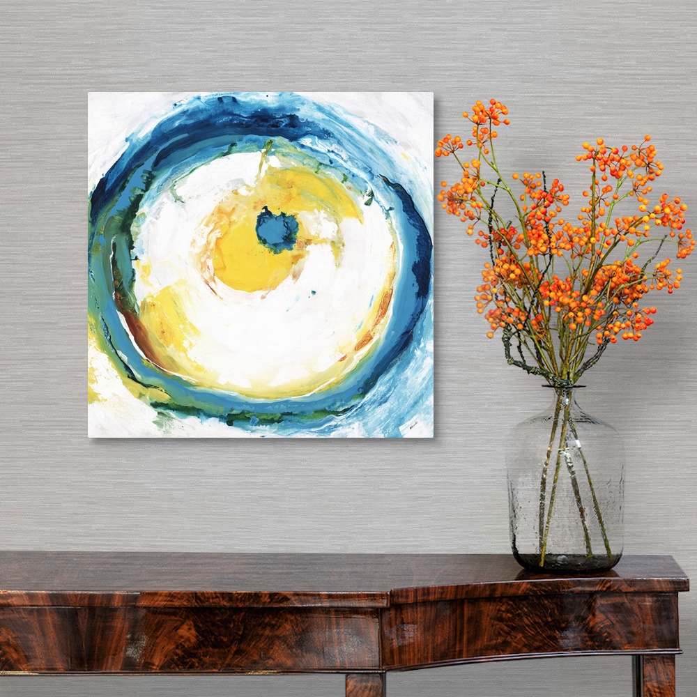 A traditional room featuring Square abstract artwork with a large circle in the center with blue, green, yellow, and orange br...