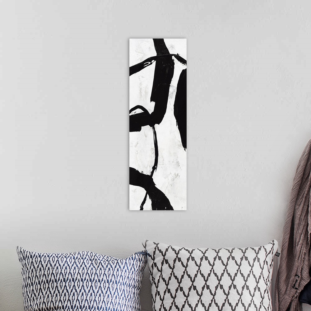 A bohemian room featuring Black and white abstract panel panting with bold brushstrokes creating movement up and down the c...