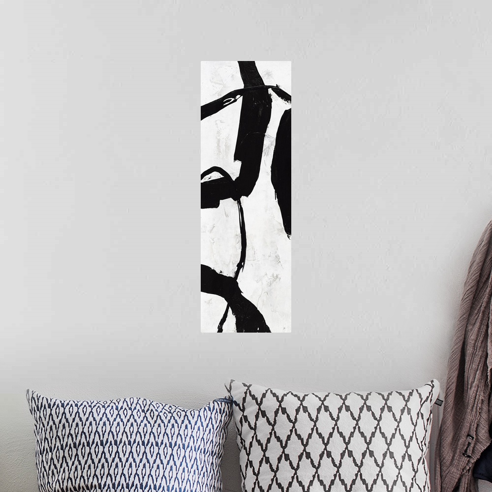 A bohemian room featuring Black and white abstract panel panting with bold brushstrokes creating movement up and down the c...