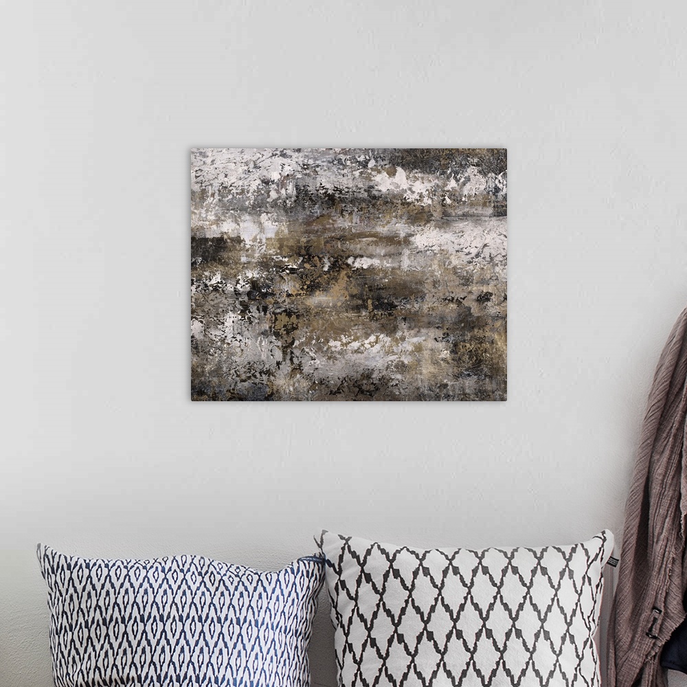 A bohemian room featuring Abstract painting using textured looking gray tones to form what almost appears as a landscape.