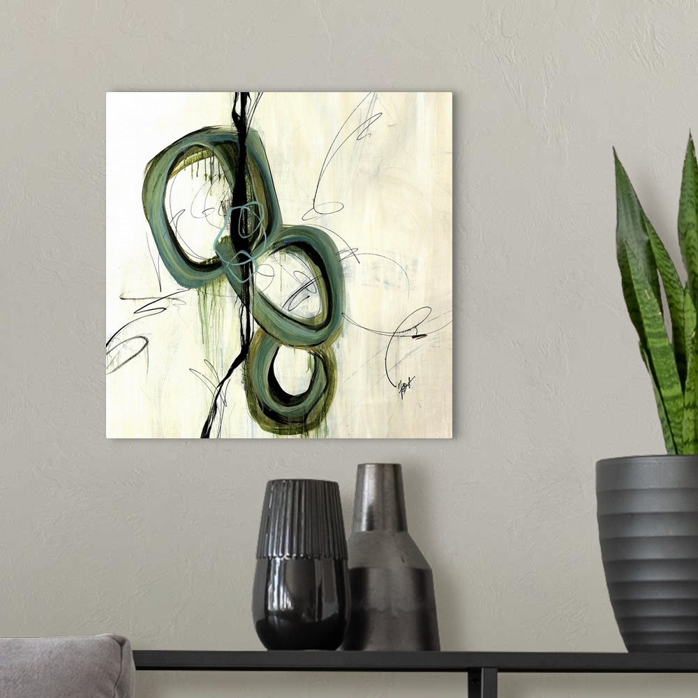 A modern room featuring Abstract art of three large intersecting circles that are vertically stacked, surrounded by thin ...