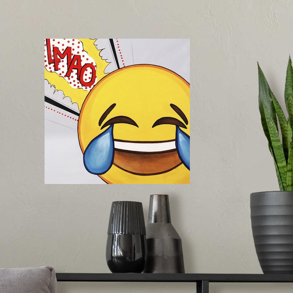 A modern room featuring Contemporary painting using a bright yellow pop art style smiley face in tearful laughter.