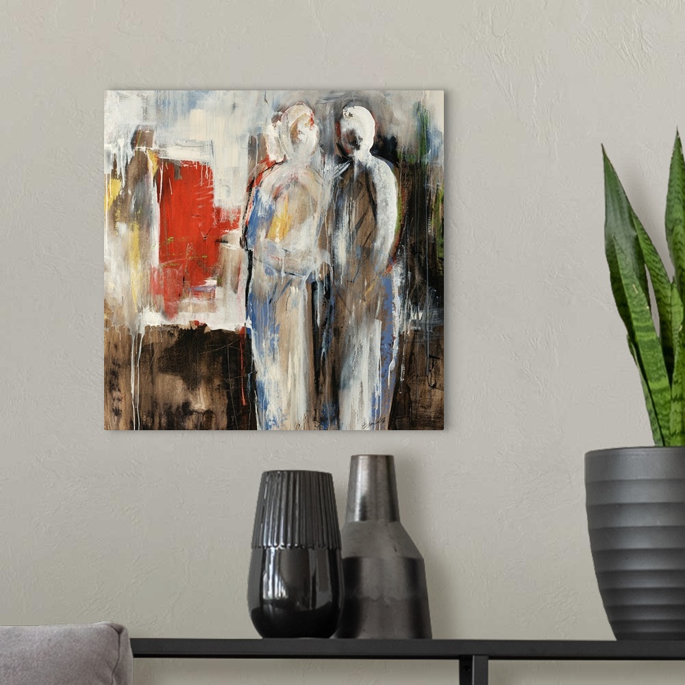 A modern room featuring An abstract painting of two figures in neutral colors with pops of red.