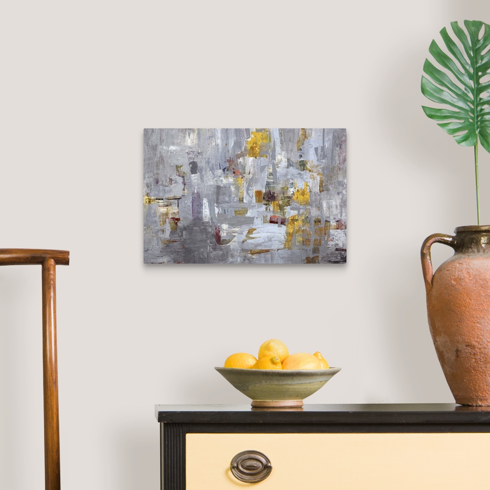 A traditional room featuring Contemporary abstract painting using mostly gray tones with hints of gold.