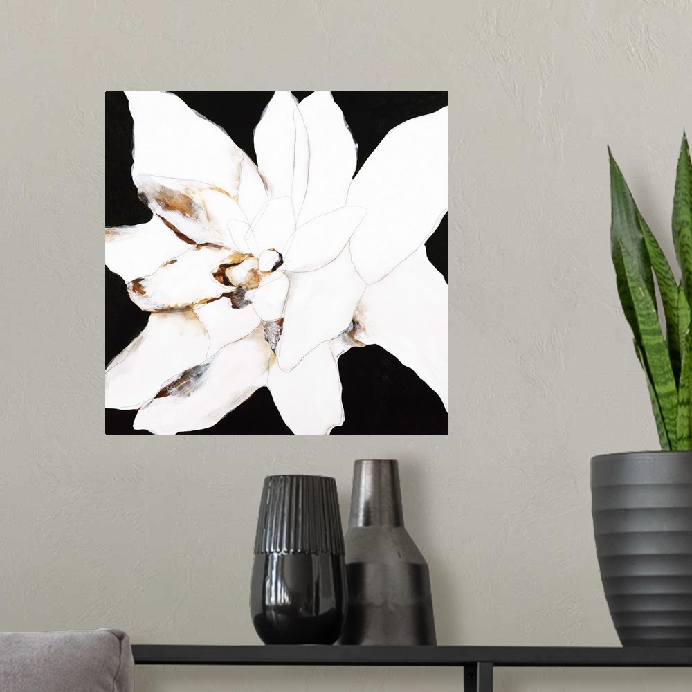 A modern room featuring Contemporary abstract painting using resembling a white flower against a black background.