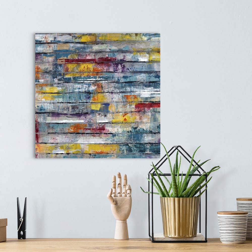 A bohemian room featuring Contemporary abstract painting of splashes of color on weathered planks.