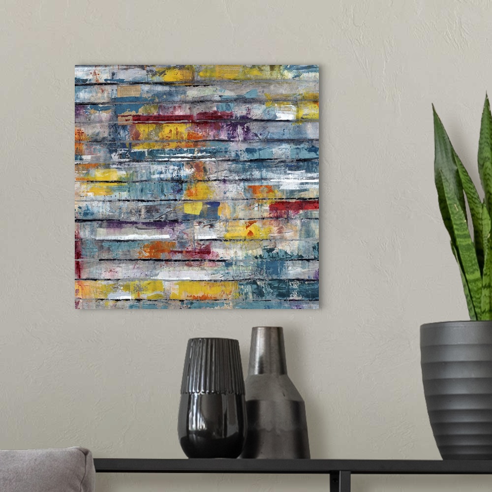 A modern room featuring Contemporary abstract painting of splashes of color on weathered planks.