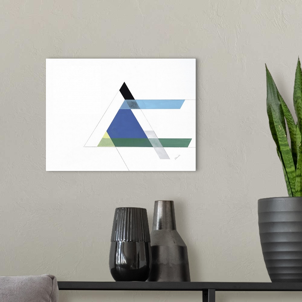 A modern room featuring A simple artwork of geometric shapes of a triangle in blue and green.