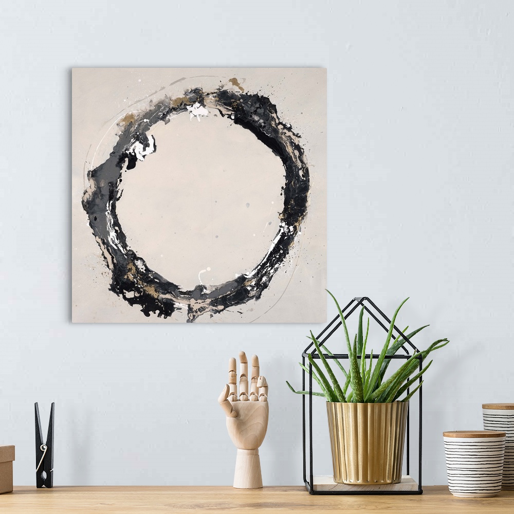 A bohemian room featuring Abstract painting using textured looking gray tones to form a circle on a neutral colored backgro...