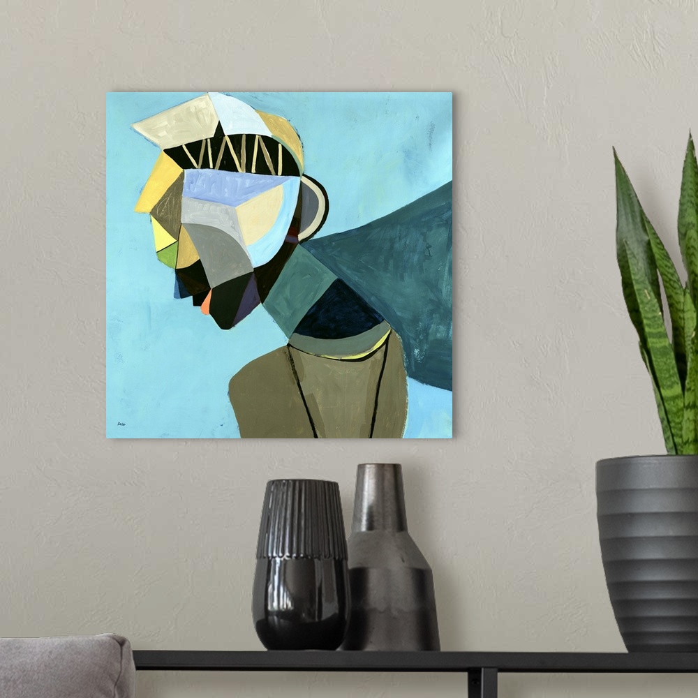 A modern room featuring Abstract painting of the profile of a woman wearing a colorful head piece, on a cool background o...