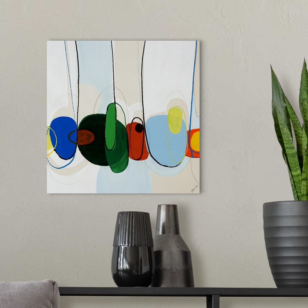 A modern room featuring Contemporary abstract artwork depicting giant candy beans squished together in a row.